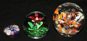 Three paperweights