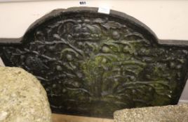 A large 16th century style cast iron fire back, W.87cm