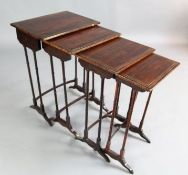A late Victorian nest of rosewood quartetto tables, with brass strung tops, W.1ft 8in. D.1ft 2in.