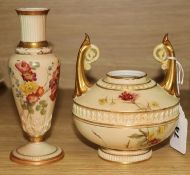 A Worcester blush ivory tea cup and saucer, and two vases