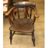 A 19th century smoker's bow armchair and another similar chair