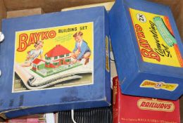 A box of toys including Meccano Triang train set and Bako building sets