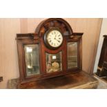 An Edwardian overmantel mirror with clock inset, W.90cm