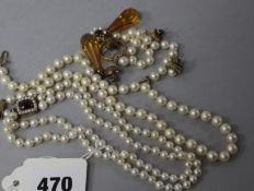 A double strand cultured pearl choker necklace with garnet clasp and other items of jewellery.