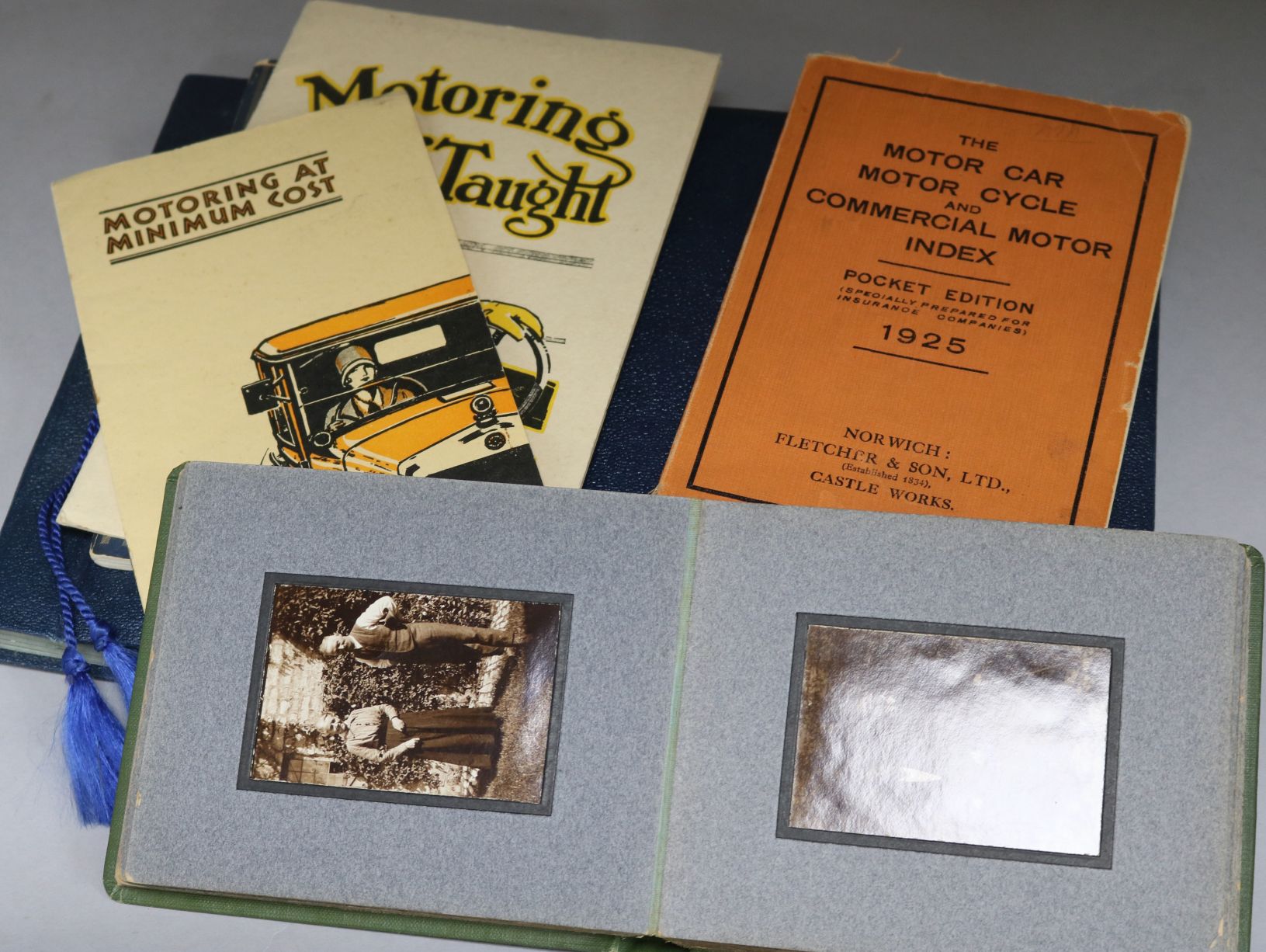 Motoring pamphlets, a photo album, a postcard album etc.