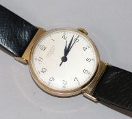 A 9ct gold-cased Longines gentleman's wristwatch, with white Arabic dial and blued steel hands, on