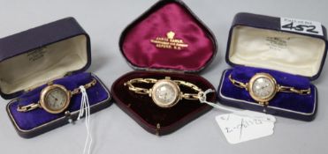 Three cased early 20th century 9ct gold wrist watches including a pair.