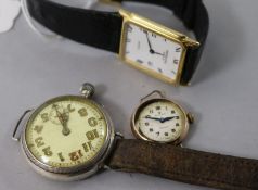 A lady's gold Rolex Precision watch and two other watches.
