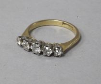 An 18ct gold, platinum and graduated five stone diamond ring, size L.