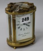 Charles Frodsham. An oval brass carriage clock
