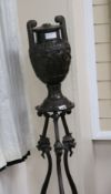 A Grecian style bronze vase on stand