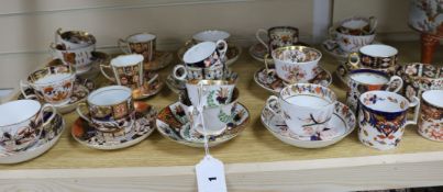 A group of 19th century Imari pattern cups and saucers and two famille verte items