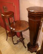An Edwardian inlaid mahogany pedestal, a Victorian walnut table and an Edwardian jardiniere stand,