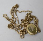 A 9ct gold guard chain and a gold plated locket, chain 58in.