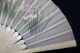 A Japanese ivory and embroidered silk fan
