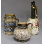 A Doulton Burslem dragon ewer, a Doulton Lambeth jug and a sgraffito jug