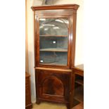 A Mahogany corner cupboard, c.1830, H.218cm