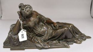 A 19th century bronze figure of a reclining maiden