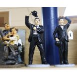 A pair of Leonardo resin figures of Laurel and Hardy and a Laurel and Hardy 'barber shop' group