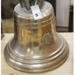 A large cast bronze ship's bell, with crown top and applied badge with initials J.B. and a harp over