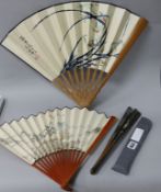 Three Chinese painted fans, bamboo sticks