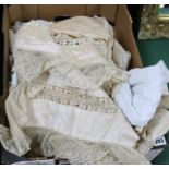 A quantity of christening gowns