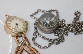A lady's 1930's 9ct gold Buren manual wind wrist watch and a later globe watch pendant on chain.
