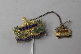 An early 20th century 9ct gold and enamel Gloucestershire Regiment two part brooch.