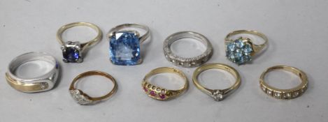 Four 18ct gold gem set rings, three 9ct rings and two other rings.