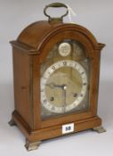 A Georgian style mahogany bracket clock retailed by Searle & Co Ltd