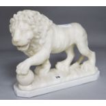 An alabaster lion on a stand