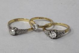 Three 18ct gold and diamond rings, one solitaire and two single stone with diamond set shoulders.
