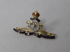 An early 20th century 15ct gold, enamel and diamond set Royal Artillery brooch, in Harrods box, 1.