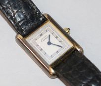 A lady's silver gilt Must de Cartier quartz wrist watch.