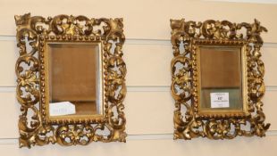 A pair of 19th century Florentine carved giltwood rectangular wall mirrors, H.25cm