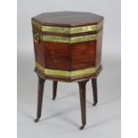 A George III brass bound mahogany octagonal cellaret, on stand, with square tapered legs, W.1ft 7in.