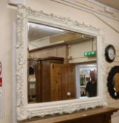 A large white painted overmantel mirror, W.150cm