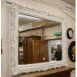 A large white painted overmantel mirror, W.150cm