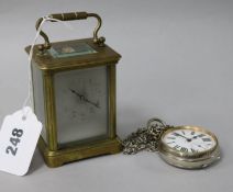 A brass carriage clock and a pocket watch