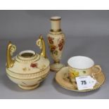 A Worcester blush ivory tea cup and saucer, and two vases