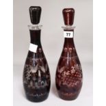 A pair of Bohemian ruby flash glass decanters