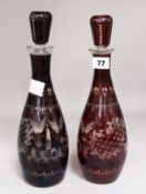 A pair of Bohemian ruby flash glass decanters