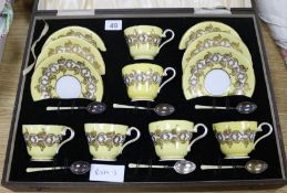 A boxed Aynsley teaset with enamelled silver spoons