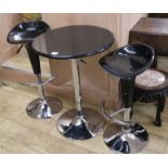 A black and chrome table and two bar stools, W.61cm