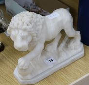An alabaster lion on a stand