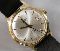 A gentleman's Swiss 9ct gold automatic wrist watch retailed by Walsh Brothers, on leather strap.