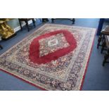 A Persian claret ground carpet, 290 x 225cm