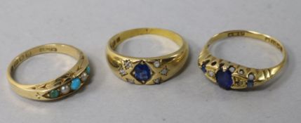 Three late 19th/early 20th century 18ct gold and gem set dress rings.