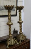 A pair of gilt metal altar candlesticks