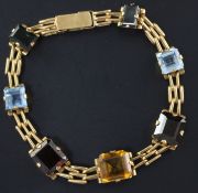 A Brazilian gold and gem set bracelet, mounted with seven stones including aquamarine and citrine,